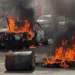 Protestas de simpatizantes del oficialismo escalan en Tegucigalpa e incendian vehículo