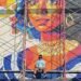 Venezolano crea en El Salvador un mural con más de 100,000 tapas recicladas en zona anteriormente dominada por pandillas